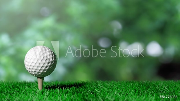 Picture of Golf ball on green turf and green background